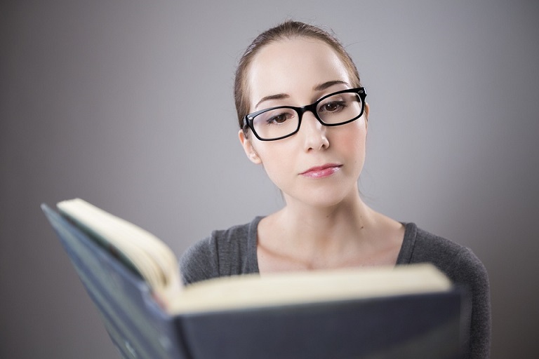 student reading book